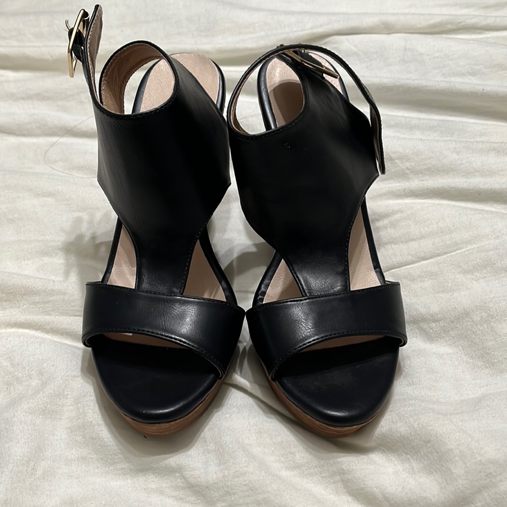 Black leather wedge sandals.